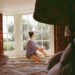 Woman sitting awake at night, caught in a cycle of worried thoughts